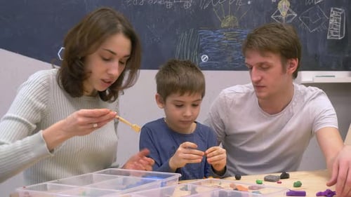 Family Creatively Working with Clay at Home