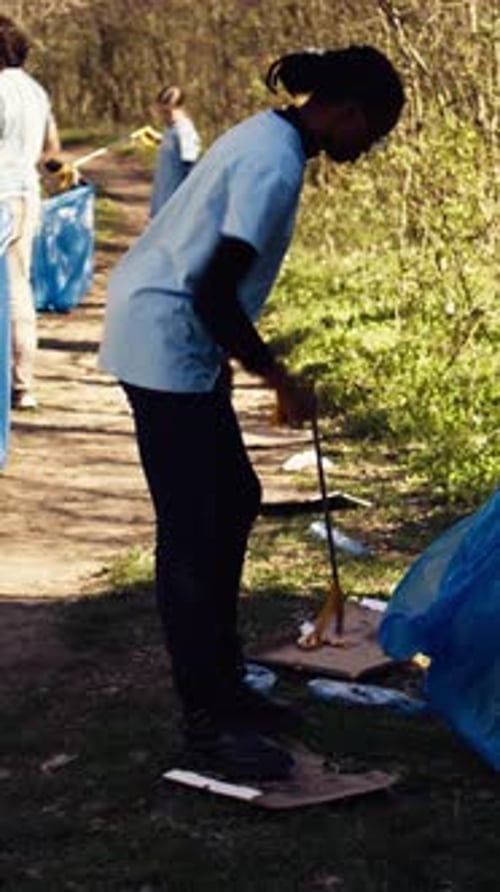 Environmental Activists Collecting Rubbish and Plastic Waste in Garbage Bag