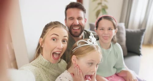 Happy Family Poses for Fun Selfie at Home