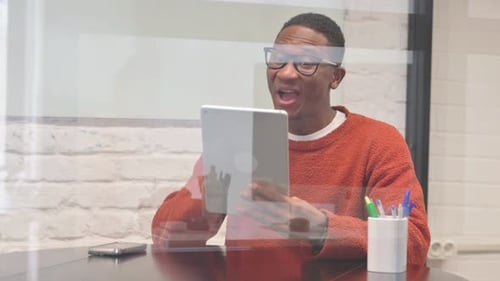 Young Adult Video Calling With Tablet