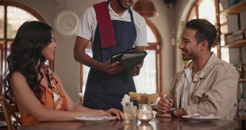 Waiter, restaurant and couple with menu, man and woman at table on date Italian cuisine with wine