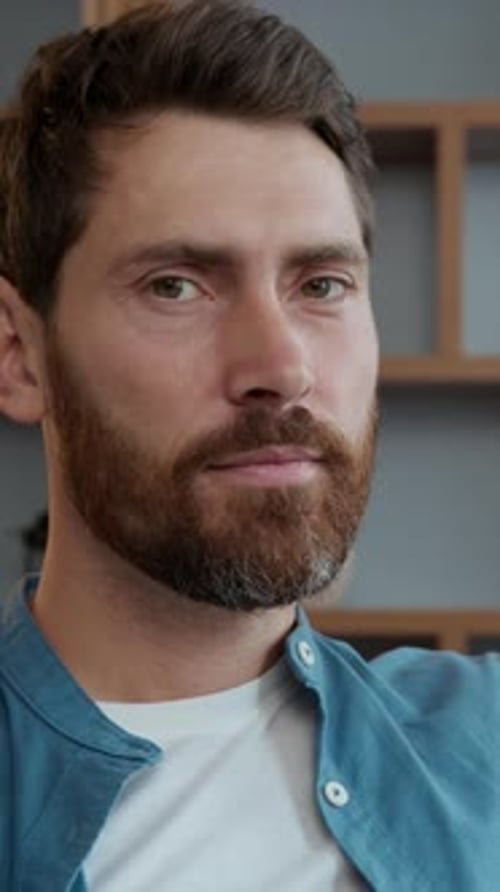 Portrait at Home Caucasian Man Thinking Look Away Serious Looking at Camera at Home Indoors in Cozy