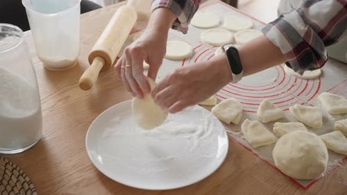 Woman Prepares Dough for Baking at Home