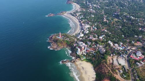 Aerial view of Vizhinjam Lighthouse and Kovalam Beach, India.