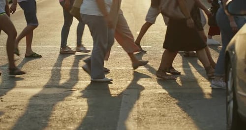 People Crossing Road in City Side View of Unrecognizable Pedestrians Walking on Asphalt Crossroad in