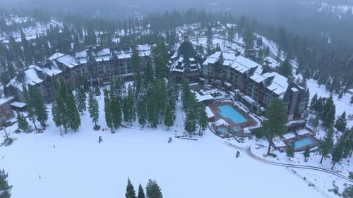 Drone Shot of Snow Covered Alpine Hotel and Ski Area