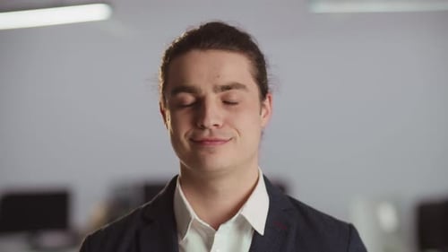 Portrait of Young Adult Man Looking at Camera