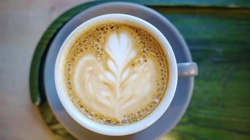 Top down shot of foam latte art on coffee