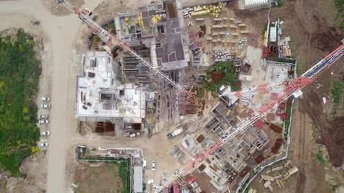Large residential construction site with cranes, Aerial view