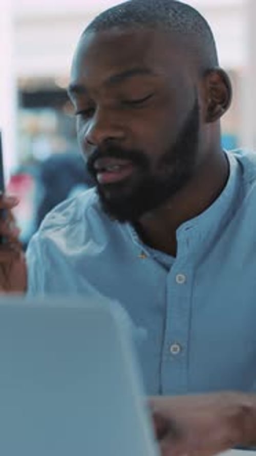 A Focused Professional Diligently Working on Laptop in a Modern Sleek Workspace Environment