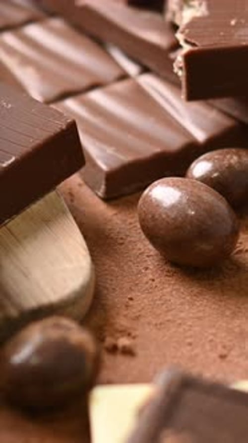 Assortment of white, milk and dark chocolate pieces background