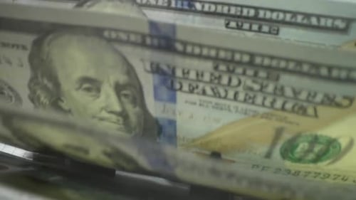 Macro Shot Counter Counting Dollar Bills Money Counting Machine with 100 Dollar Banknotes Bank