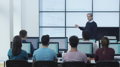 Students Learning Coding in Bright Tech Classroom