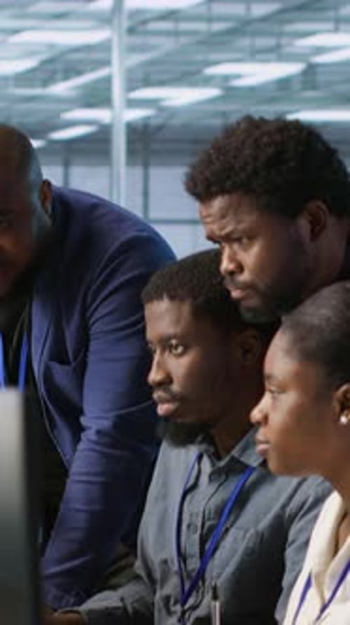 Vertical Video Coworkers in Data Center Doing Brainstorming Implementing AI