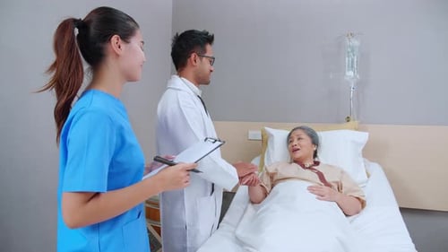 Specialist doctor man and nurse explaining and check with elderly patient in hospital.