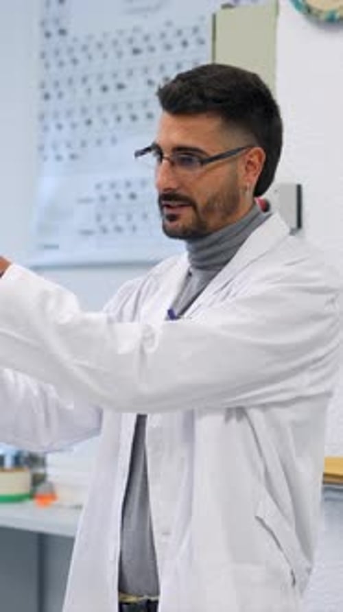 Chemistry Teacher Performing Experiment in Laboratory