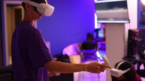Young Adults Play Immersive Video Games With VR Headsets