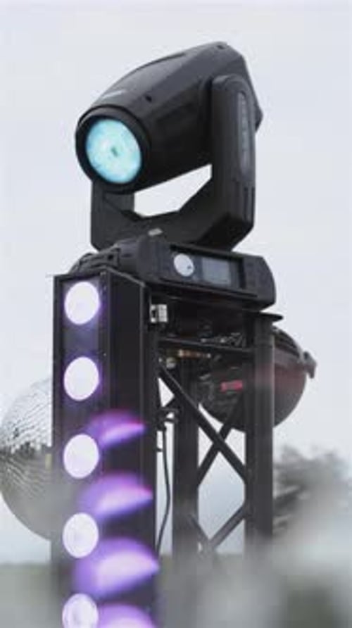 Concert Lights on a Rig Pulsing White Light