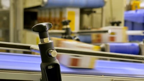 Blurred packages on the conveyor belt in a distribution center