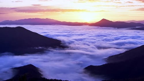 Dramatic Mountain Range Filled with Low-Lying Clouds