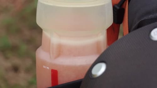 Electrolyte tablet dissolving in bicycle bottle creating bubbles during ride