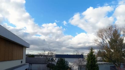 Dramatic Sky with Fast Moving Clouds Over City
