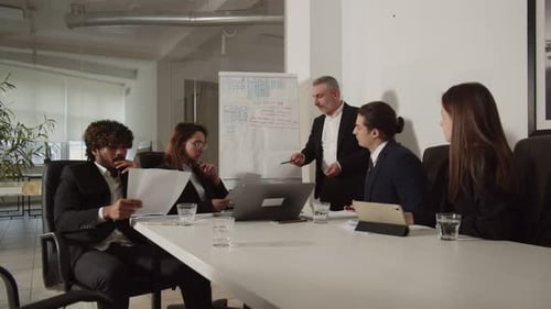Business Professionals Meeting in Modern Conference Room