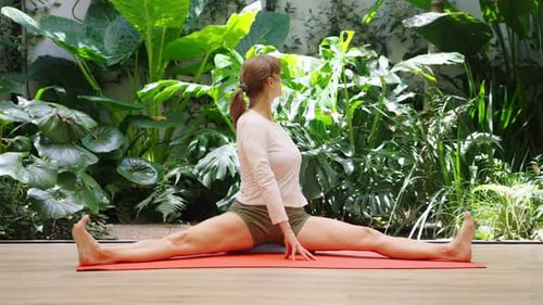 Woman in mindful relaxation posture in modern studio