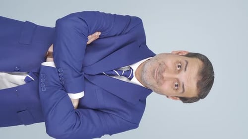 Man in Blue Suit with Arms Crossed Portrait