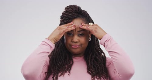 Woman Massaging Temples Due to Stress or Headache