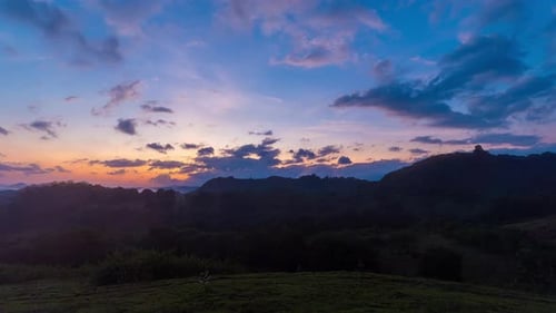 Majestic Mountain Range at Sunrise with Clouds