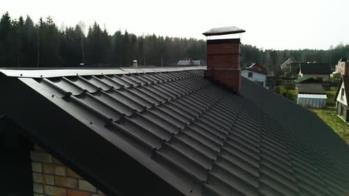 Aerial View of Peaceful Suburban Houses and Forest