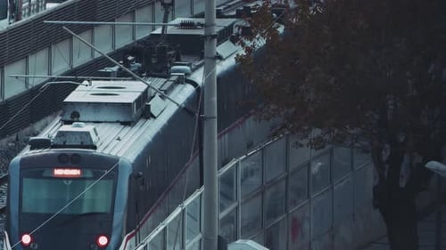 Passenger Train Passing Through Urban Railway Line