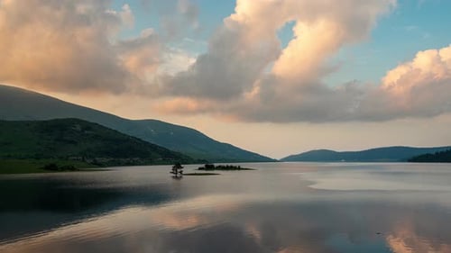 Sunset view of а mountain lake and beautiful reflections