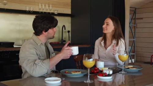 Couple Enjoying Breakfast Together at Home