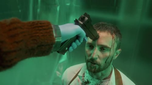 Bearded Man at Gunpoint in a Claustrophobic Room