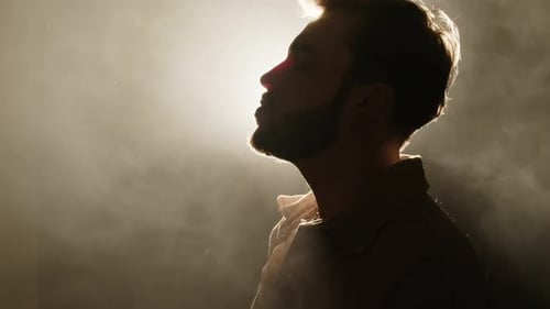 Man in Silhouette Speaking with Bright Foggy Background