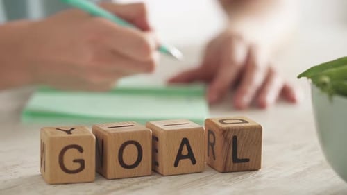 Word GOAL is assembled from cubes. concept of visioning the future, setting goal, building strategy