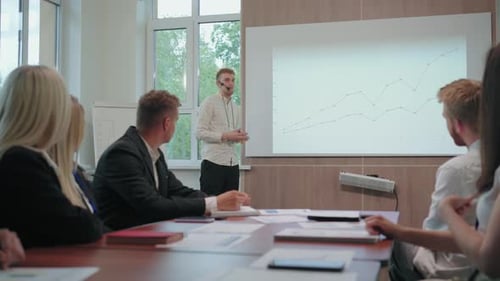 Leading Expert in Marketing and Advertising is Presenting Report in Business Meeting or Seminar