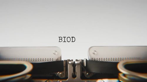 Old mechanical typewriter typing Biodegradable in a close-up view.