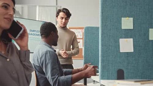 Team of Colleagues Chatting at Workplace