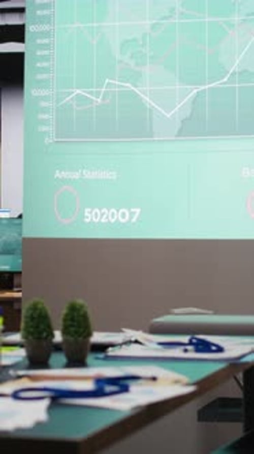 Vertical Video Modern Corporate Space Sits Empty After Hours with Forecasting Charts