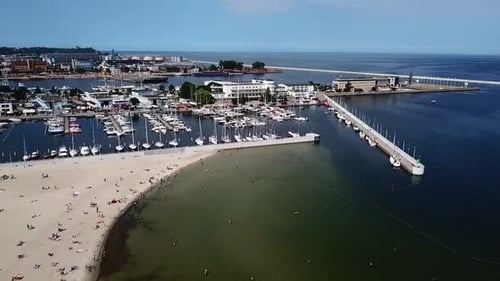 Flying over beach and marina