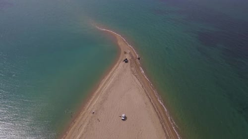 4k tilt up clip over a peninsula on the tropical beach of Epanomi, Halkidiki, Greece