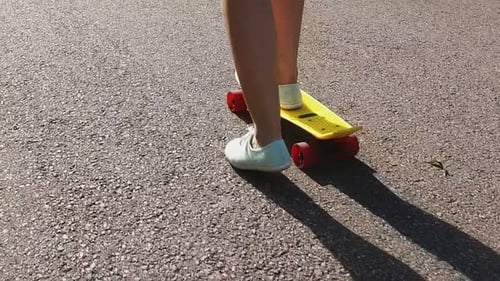 Skateboarding, Leisure, Extreme Sport and People Concept - Teenage Girl Feet Riding