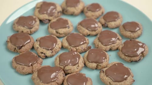 Chocolate cookies with cranberry of wholemeal flour and poppy seeds - close up. 4K