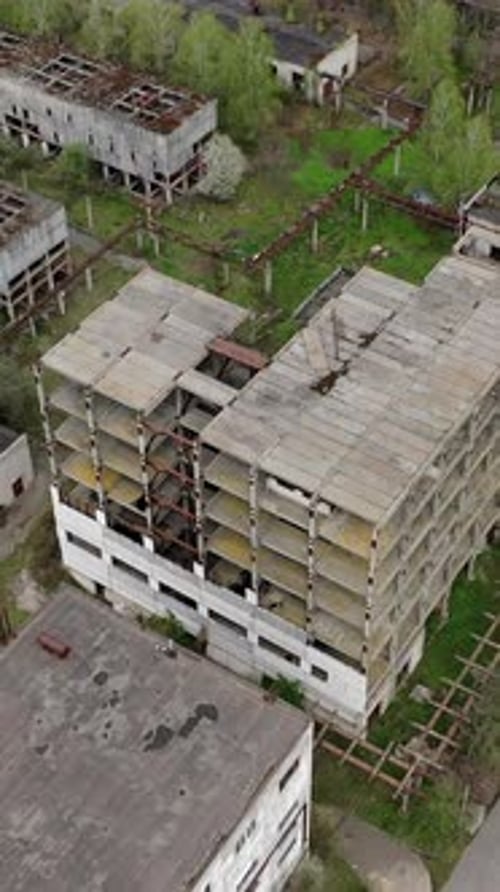 Ruined factory buildings. Abandoned warehouses or production department on the factory territory.