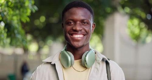 Face, black man and student outdoor with headphones for college, environmental study and education