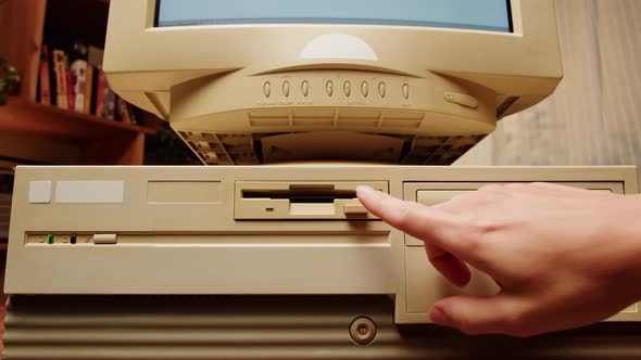 Hand Inserts Floppy Disk into Vintage Computer, Technology Stock ...