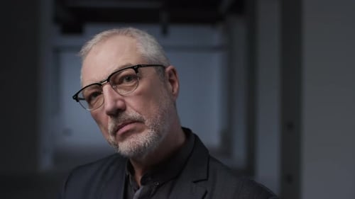 Man with Glasses Looking Directly into Camera